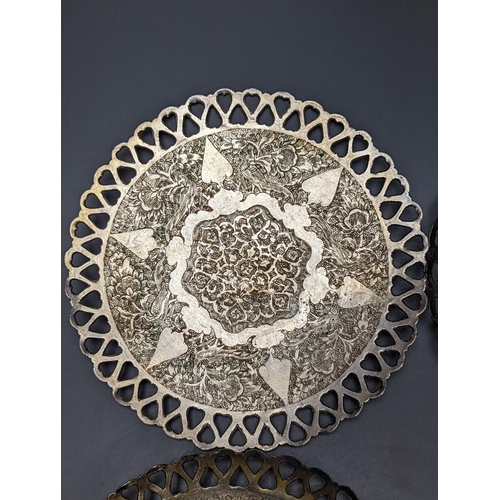 803 - A set of six Persian white metal circular shallow dishes, with pierced borders, 16.3cm, 972 grams.... 