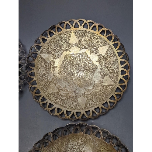 803 - A set of six Persian white metal circular shallow dishes, with pierced borders, 16.3cm, 972 grams.... 