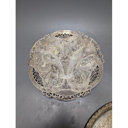 807 - A Persian engraved white metal circular drink's tray by Vartan, 32cm, 747 grams and a white metal wa... 