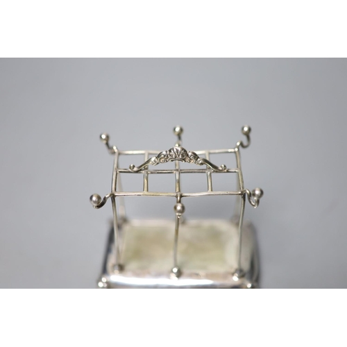 830 - An Edwardian silver mounted hat pin? and ring stand, Mappin Bros. Birmingham, 1909, height 8.1cm.... 