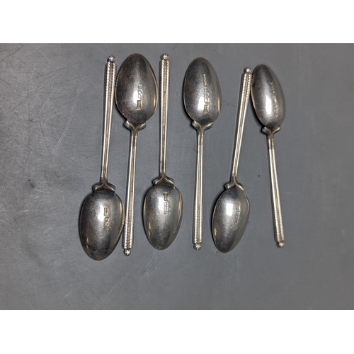 831 - A set of six 1960's silver golfing related coffee spoons, by Walker & Hall, 68 grams.