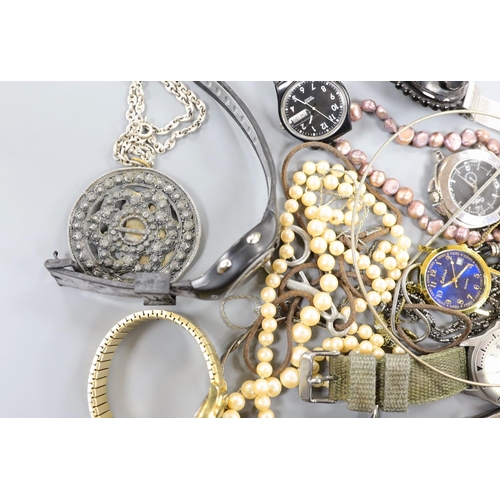 883 - A small quantity of modern minor wrist watches and assorted costume jewellery.