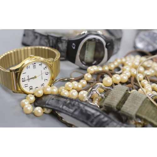 883 - A small quantity of modern minor wrist watches and assorted costume jewellery.