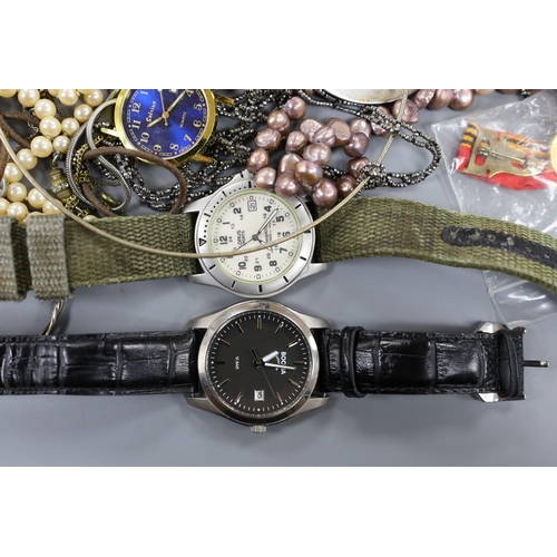 883 - A small quantity of modern minor wrist watches and assorted costume jewellery.