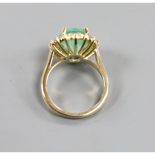 884 - A modern 14k yellow metal, emerald and diamond set oval cluster ring, size M, gross weight 5.9 grams... 