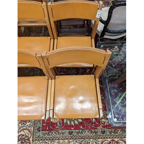 89 - A set of eight mid century design walnut and tan leather dining chairs, width 48cm, depth 44cm, heig... 