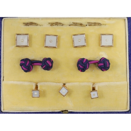 893 - A modern cased seven (ex 9) piece 9ct gold, mother of pearl and seed pearl set dress stud set, gross... 