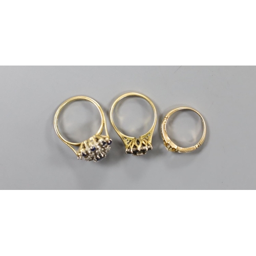 910 - A George V 18ct gold and claw set solitaire diamond ring, size G/H and two later 18ct gold and gem s... 