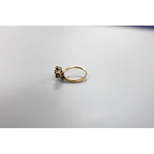 923 - A 585 yellow metal, sapphire and diamond set dress ring, size G, gross weight 2.9 grams.... 