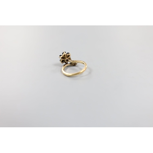 923 - A 585 yellow metal, sapphire and diamond set dress ring, size G, gross weight 2.9 grams.... 