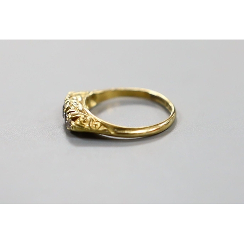 926 - An early 20th century 19ct gold and graduated five stone diamond set half hoop ring, size G, gross w... 