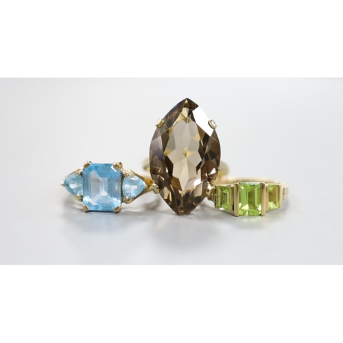 938 - A modern 9ct gold and quartz set dress ring, gross 7.5 grams, a 10k and gem set ring, gross 3 grams ... 