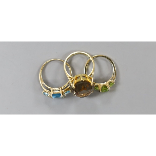 938 - A modern 9ct gold and quartz set dress ring, gross 7.5 grams, a 10k and gem set ring, gross 3 grams ... 