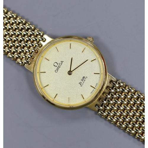 944 - A gentleman's steel and gold plated Omega De Ville quartz wrist watch.