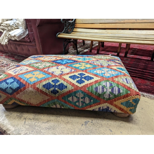 95 - A rectangular Kilim footstool on flat bun feet, length 98cm, depth 62cm, height 22cm