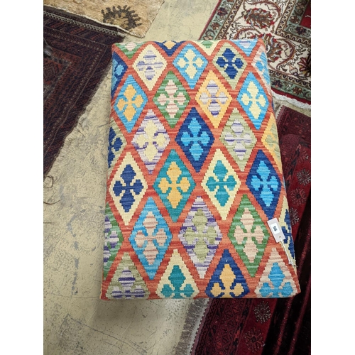 95 - A rectangular Kilim footstool on flat bun feet, length 98cm, depth 62cm, height 22cm