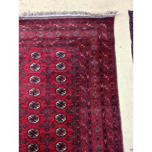 96 - A Bokhara burgundy ground rug, 190 x 130cm