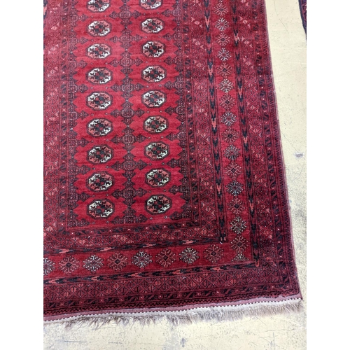 96 - A Bokhara burgundy ground rug, 190 x 130cm