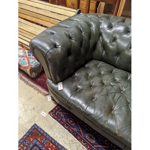 97 - A late Victorian buttoned green leather Chesterfield settee, length 184cm, depth 82cm, height 70cm... 