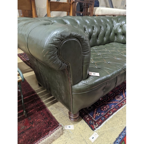 97 - A late Victorian buttoned green leather Chesterfield settee, length 184cm, depth 82cm, height 70cm... 