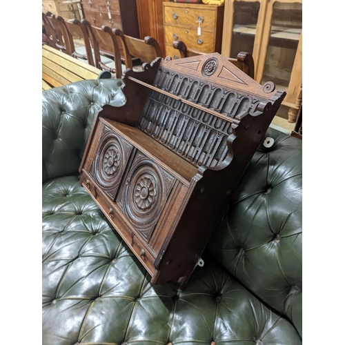 98 - A Victorian carved oak Arts and Crafts wall cabinet, width 55cm, depth 18cm, height 68cm... 