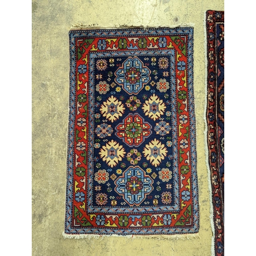 99 - A Hamadan blue ground floral rug and a smaller Caucasian design blue ground rug, larger 210 x 130cm... 