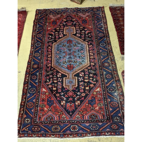 99 - A Hamadan blue ground floral rug and a smaller Caucasian design blue ground rug, larger 210 x 130cm... 