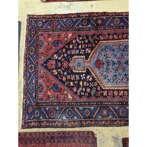 99 - A Hamadan blue ground floral rug and a smaller Caucasian design blue ground rug, larger 210 x 130cm... 