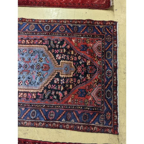 99 - A Hamadan blue ground floral rug and a smaller Caucasian design blue ground rug, larger 210 x 130cm... 