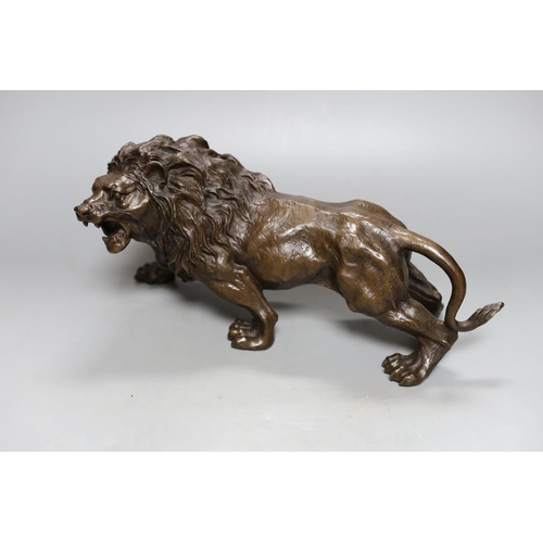 357 - A bronze lion, bearing a signature, Rodin, 31cm.