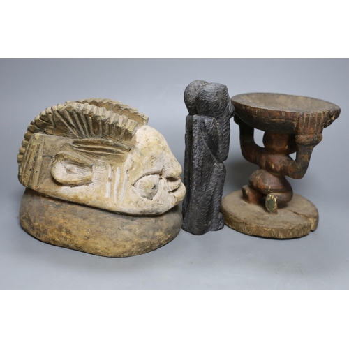 358 - A tribal figural stool (15.5cm), similar mask head-dress and two smaller hardwood carvings... 