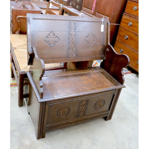 21 - A 1930's oak monk's bench, length 87cm, depth 44cm, height 77cm