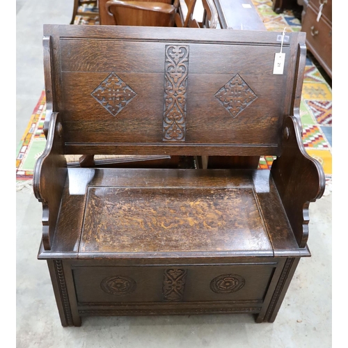 21 - A 1930's oak monk's bench, length 87cm, depth 44cm, height 77cm