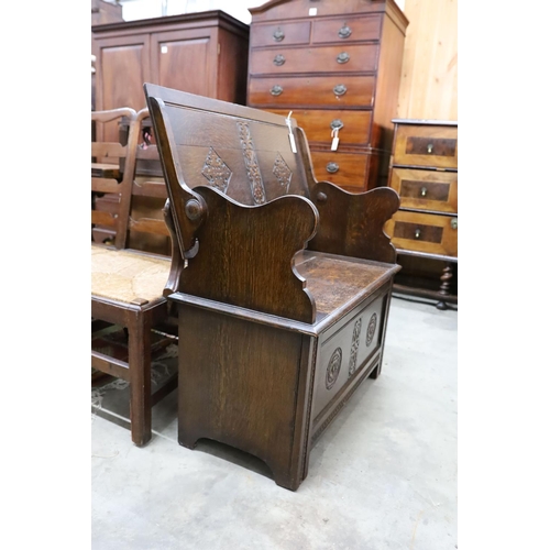 21 - A 1930's oak monk's bench, length 87cm, depth 44cm, height 77cm
