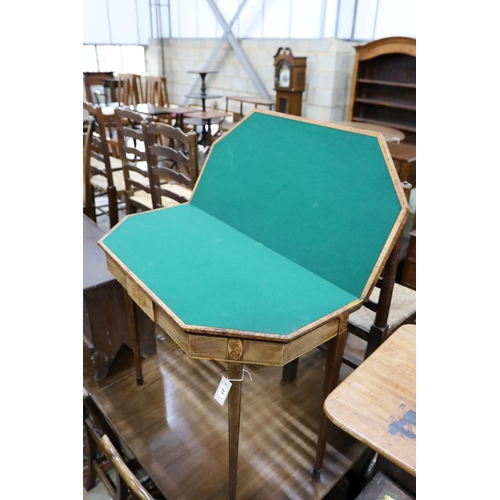 27 - A George III banded and inlaid mahogany folding card table, width 91cm, depth 44cm, height 75cm... 
