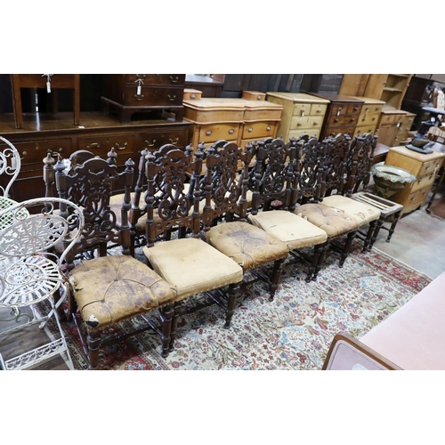 38 - A set of fourteen 19th century Continental carved oak dining chairs