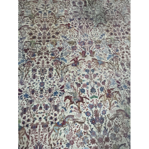 39 - A Tabriz ivory ground pictorial rug (signed), 390 x 294cm