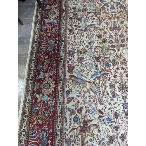 39 - A Tabriz ivory ground pictorial rug (signed), 390 x 294cm