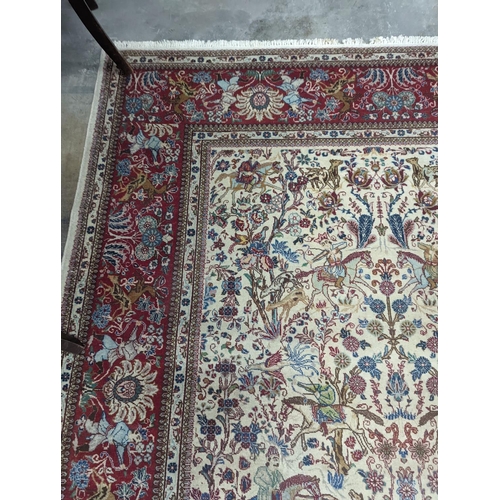 39 - A Tabriz ivory ground pictorial rug (signed), 390 x 294cm