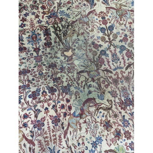 39 - A Tabriz ivory ground pictorial rug (signed), 390 x 294cm
