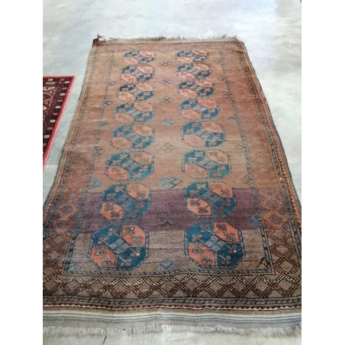 48 - An Afghan red ground rug, 240 x 146cm
