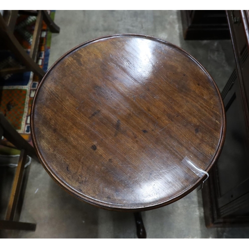 52 - A George III mahogany circular tilt top tripod table, diameter 50cm, height 70cm