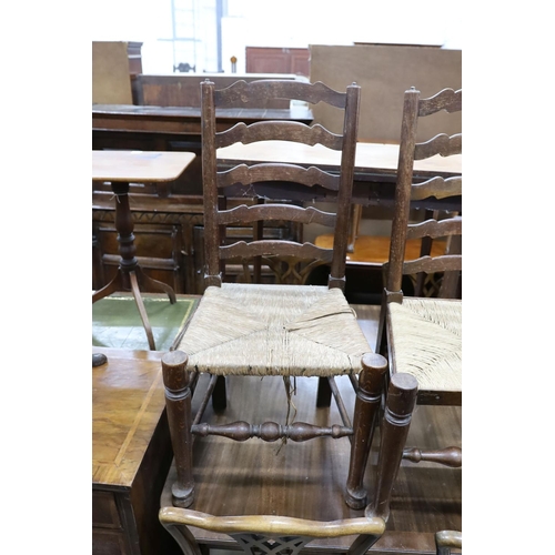 54 - A set of six oak rush seat ladder back chairs