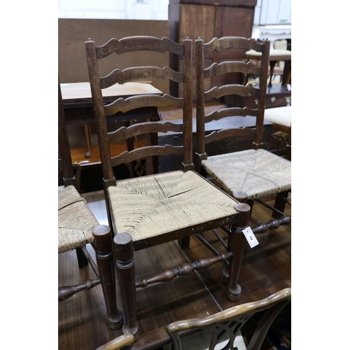54 - A set of six oak rush seat ladder back chairs