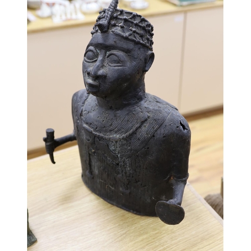 1380 - A group of Nigerian cast metal figures, bangles and a dish,  tallest 36 cms high.