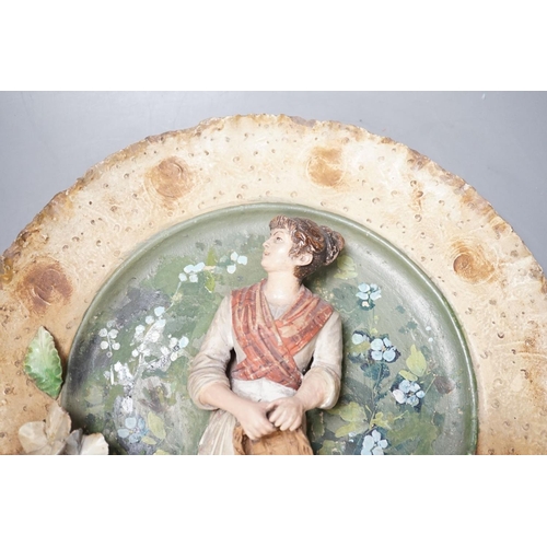 1392 - A Continental terracotta wall plaque and a Poutney & Co plaque (2) 39cm