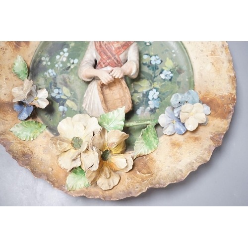 1392 - A Continental terracotta wall plaque and a Poutney & Co plaque (2) 39cm