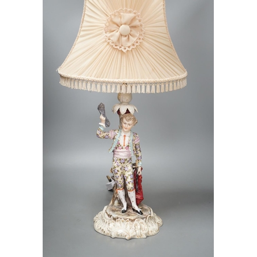 1408 - A German porcelain 'matador' lamp and shade 57cm total