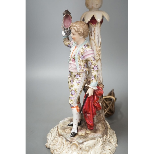 1408 - A German porcelain 'matador' lamp and shade 57cm total