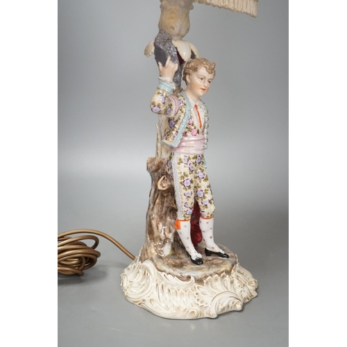 1408 - A German porcelain 'matador' lamp and shade 57cm total